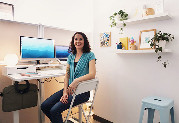 Lydia Roberts sits at her desk